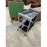 A POLISHED ALLOY THREE TIER TROLLEY WITH GLASS SHELVES, 29 X 18"