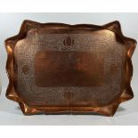 A LARGE ARTS AND CRAFTS COPPER TRAY WITH FLORAL DESIGN, DIAMETER 42 CM