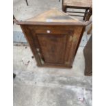 A SMALL OAK GEORGE II STYLE CORNER CUPBOARD WITH H-BRASS HINGES, 19" WIDE