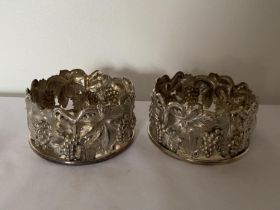 A PAIR OF PORTUGUESE TOPAZIO CASQUINHA ORNATE SILVER PLATED WINE COASTERS, T CROWN MARK AND DATE