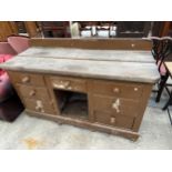 A VICTORIAN PINE KITCHEN DRESSER BASE ENCLOSING SEVEN DRAWERS WITH SCRUB TOP, 60" WIDE