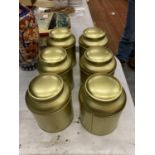 SIX GOLD COLOURED TEA CADDIES, ONE CONTAINING 'TEA FROM THE MANOR' CHRISTMAS BLEND TEABAGS