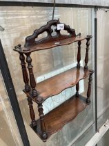 A VINTAGE MAHOGANY THREE TIER WALL SHELF