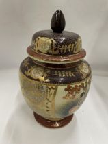 A VINTAGE JAPANESE SATSUMA HAND PAINTED LIDDED TEMPLE JAR AND COVER