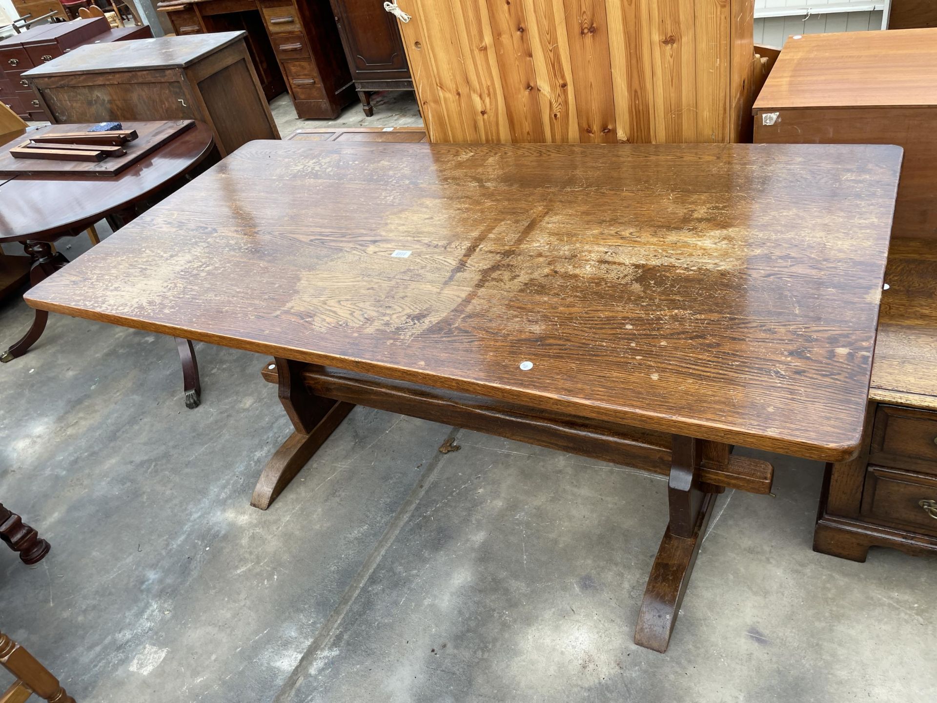 A REPRODUCTION OAK REFECTORY STYLE DINING TABLE, 66 X 31"