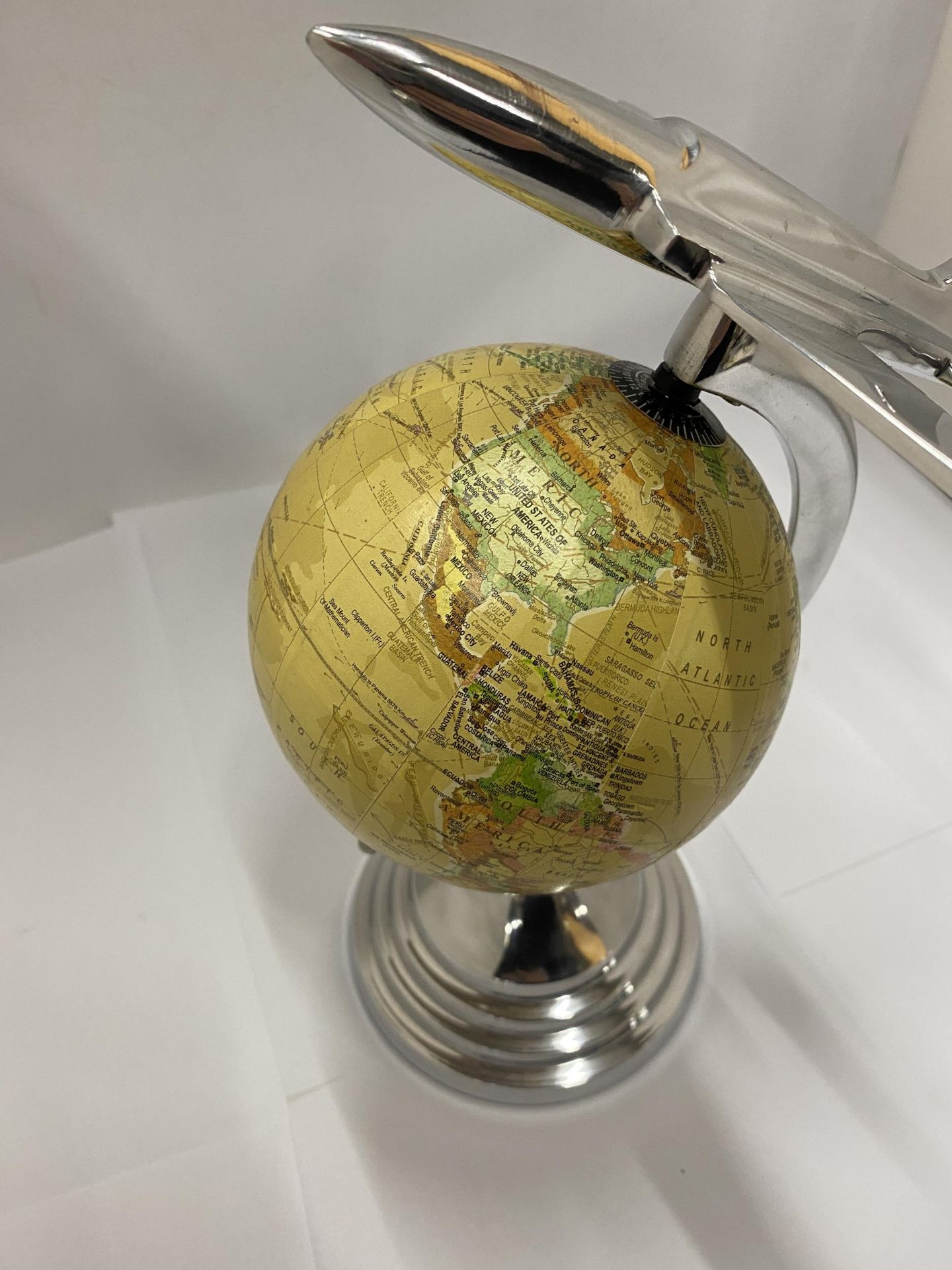 A DESK GLOBE WITH CHROME EFFECT BASE AND AEROPLANE DESIGN - Image 3 of 3