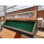 A BLACK PAINTED CORNER DISPLAY CASE WITH GLASS DOOR AND GREEN BAIZE LINING, 14.5" WIDE