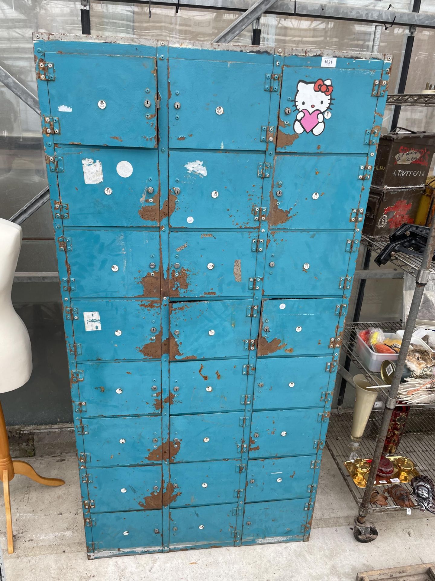 A LARGE METAL 24 SECTION LOCKER UNIT