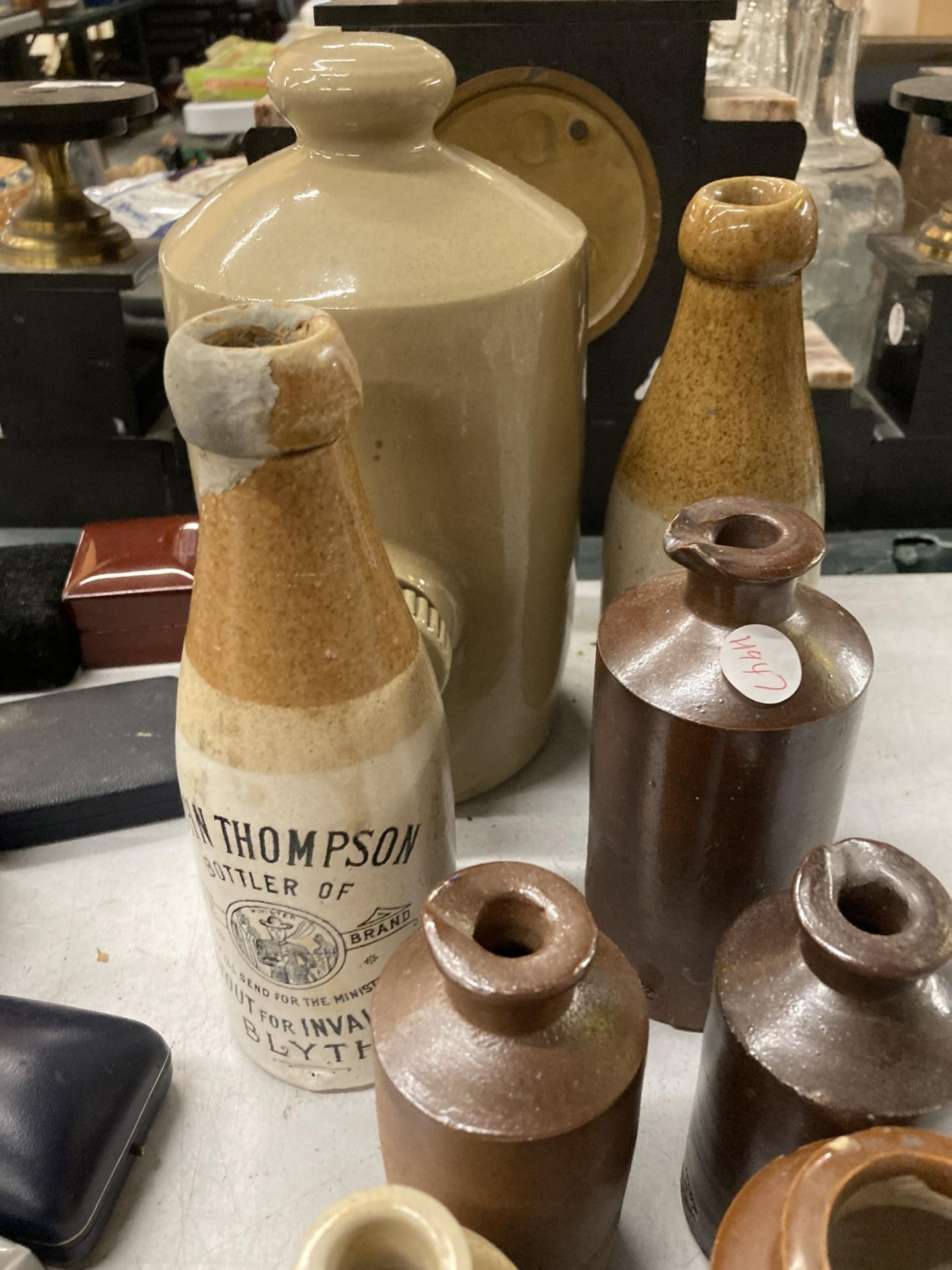 A COLLECTION OF VINTAGE STONEWARE BOTTLES TO INCLUDE 'JOHN THOMPSON, BOTTLER OF STOUT FOR - Image 4 of 4