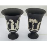 A PAIR OF WEDGWOOD BLACK JASPERWARE SACRIFICE PATTERN PEDESTAL VASES