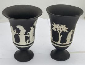 A PAIR OF WEDGWOOD BLACK JASPERWARE SACRIFICE PATTERN PEDESTAL VASES