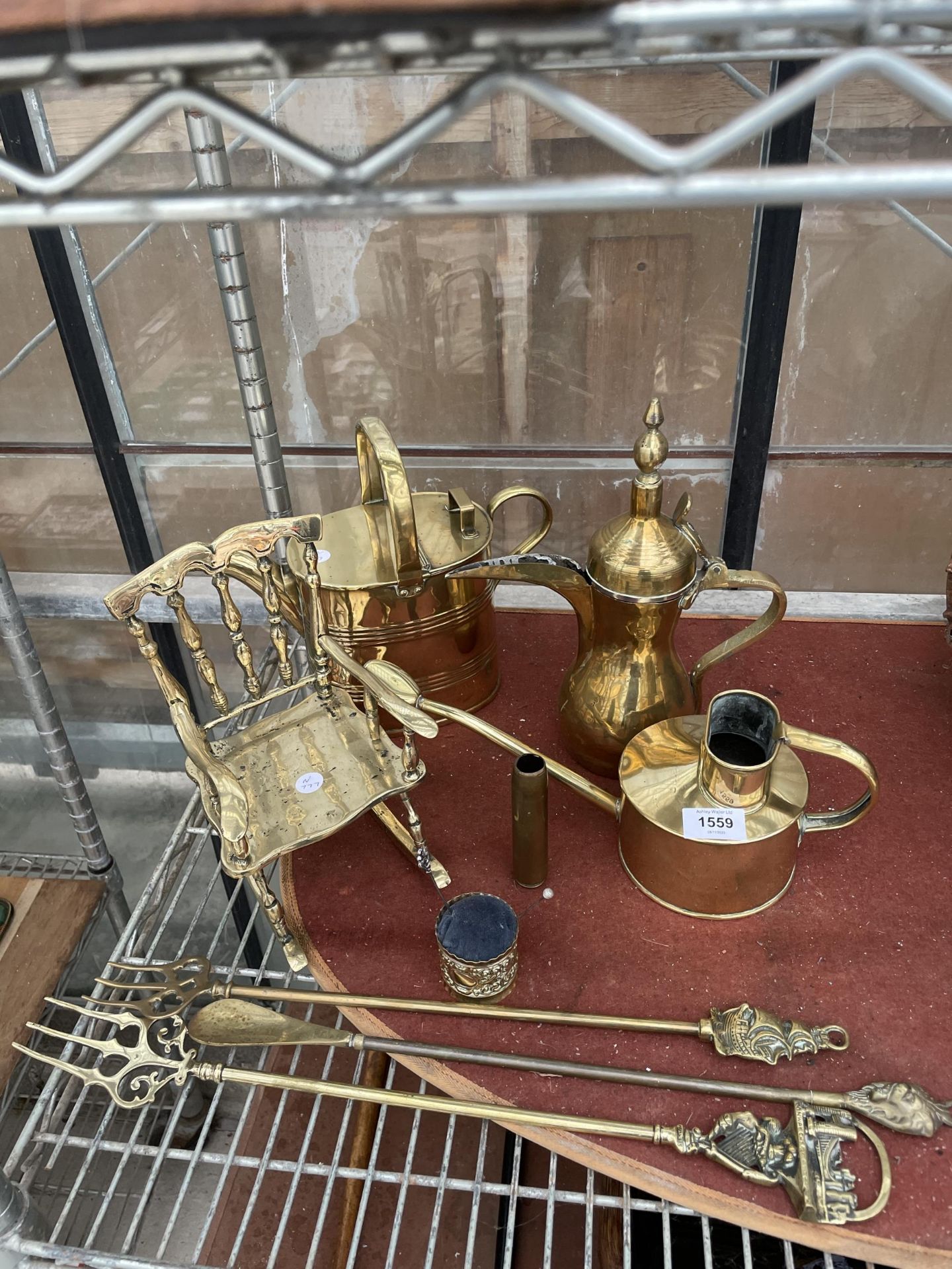 AN ASSORTMENT OF BRASS WARE TO INCLUDE A ROCKING CHAIR, A MIDDLE EASTERN JUG AND A WATERING CAN ETC