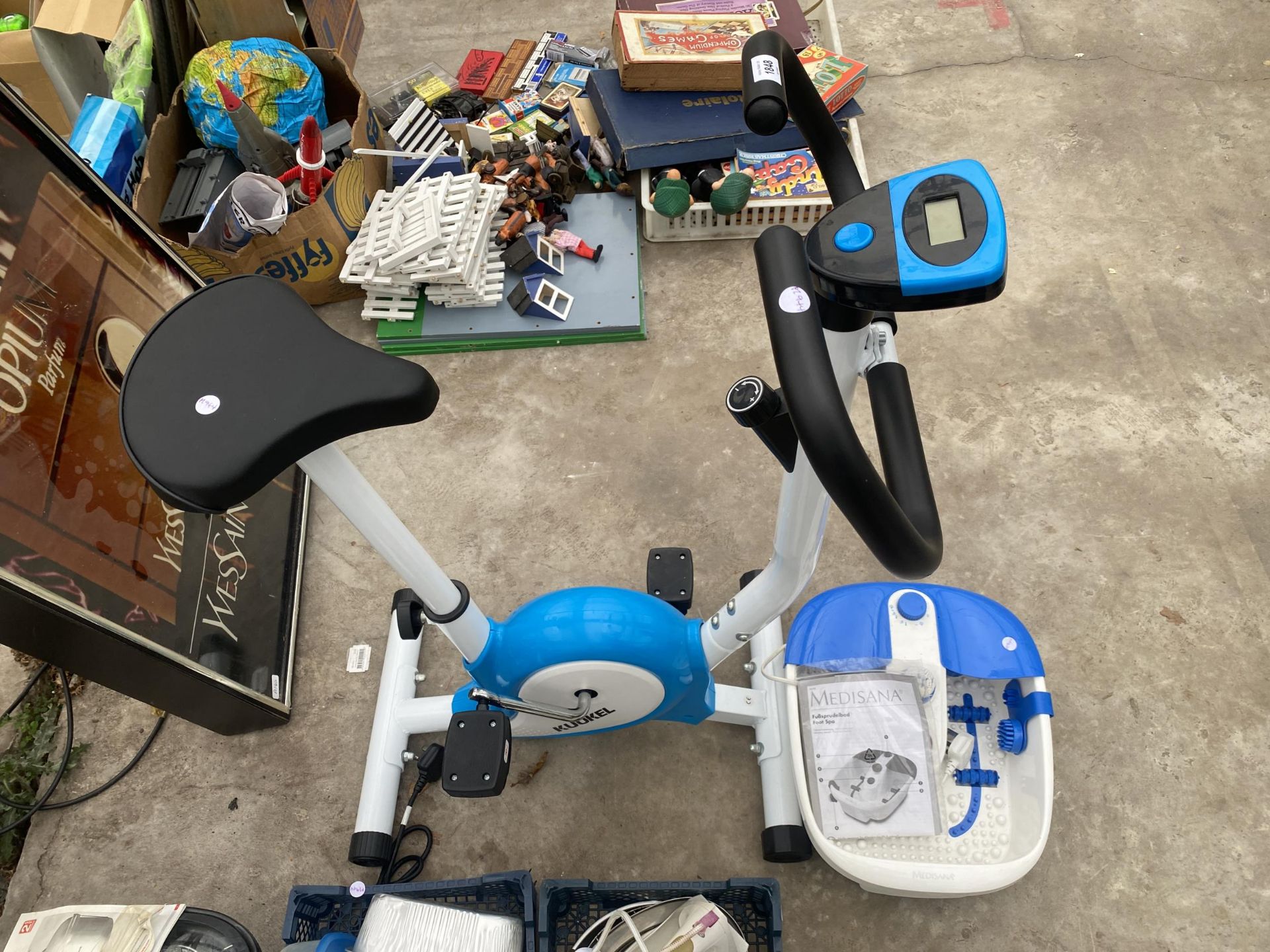 AN EXERCISE BIKE AND A FOOT SPA