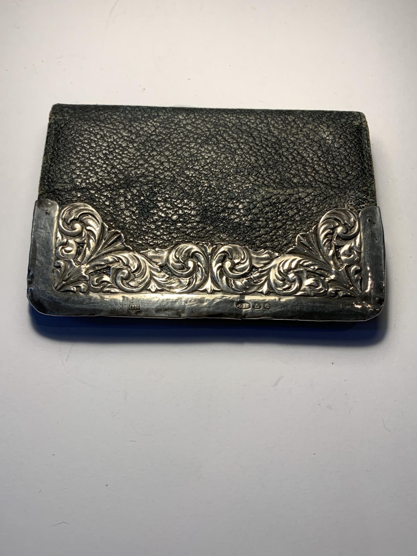 A SILVER AND LEATHER PURSE