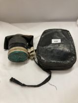 A WW11 HOME GUARD GAS MASK IN THE ORIGINAL CASE