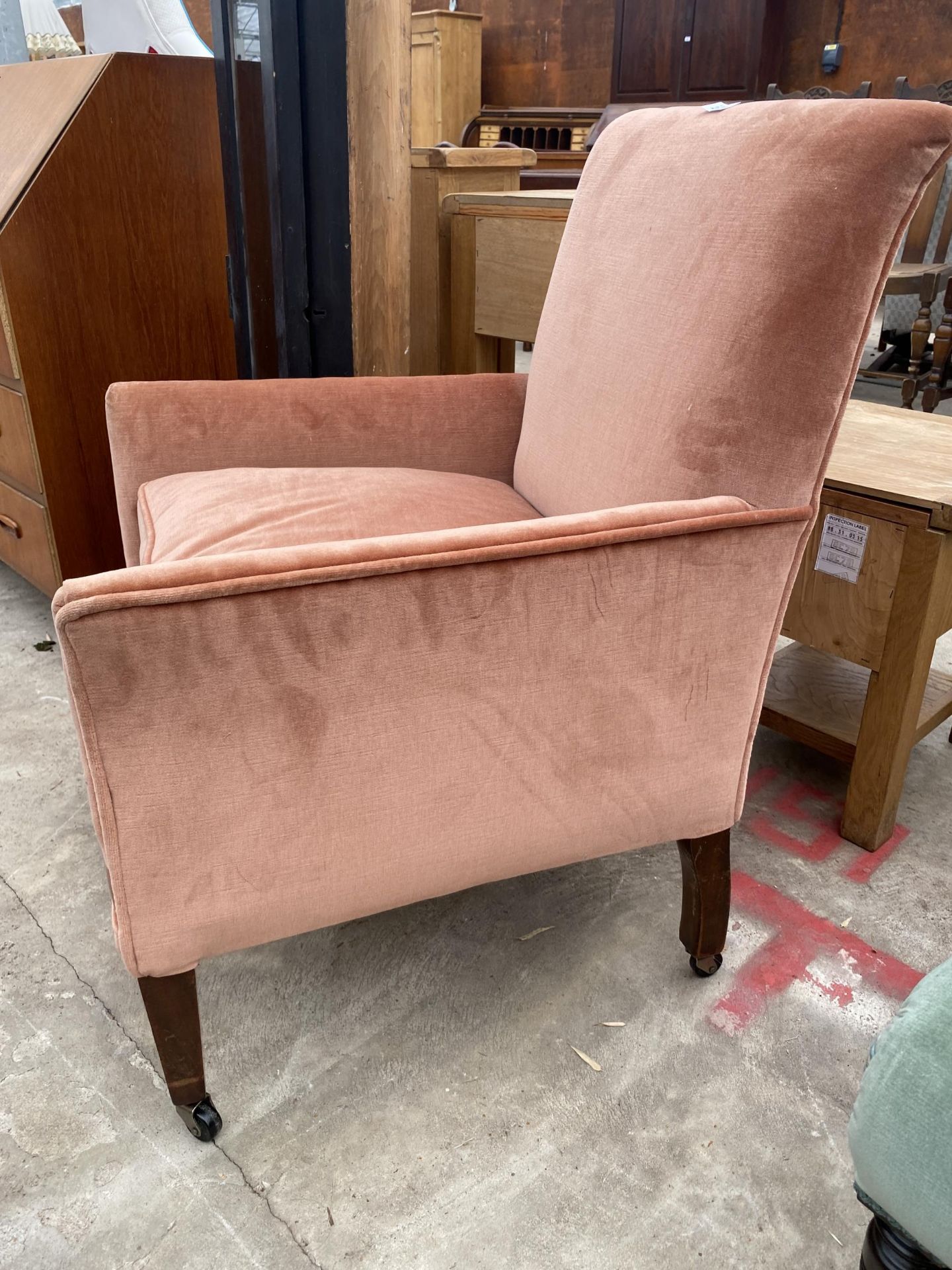 AN EDWARDIAN FIRESIDE CHAIR ON TAPERING LEGS - Image 2 of 3