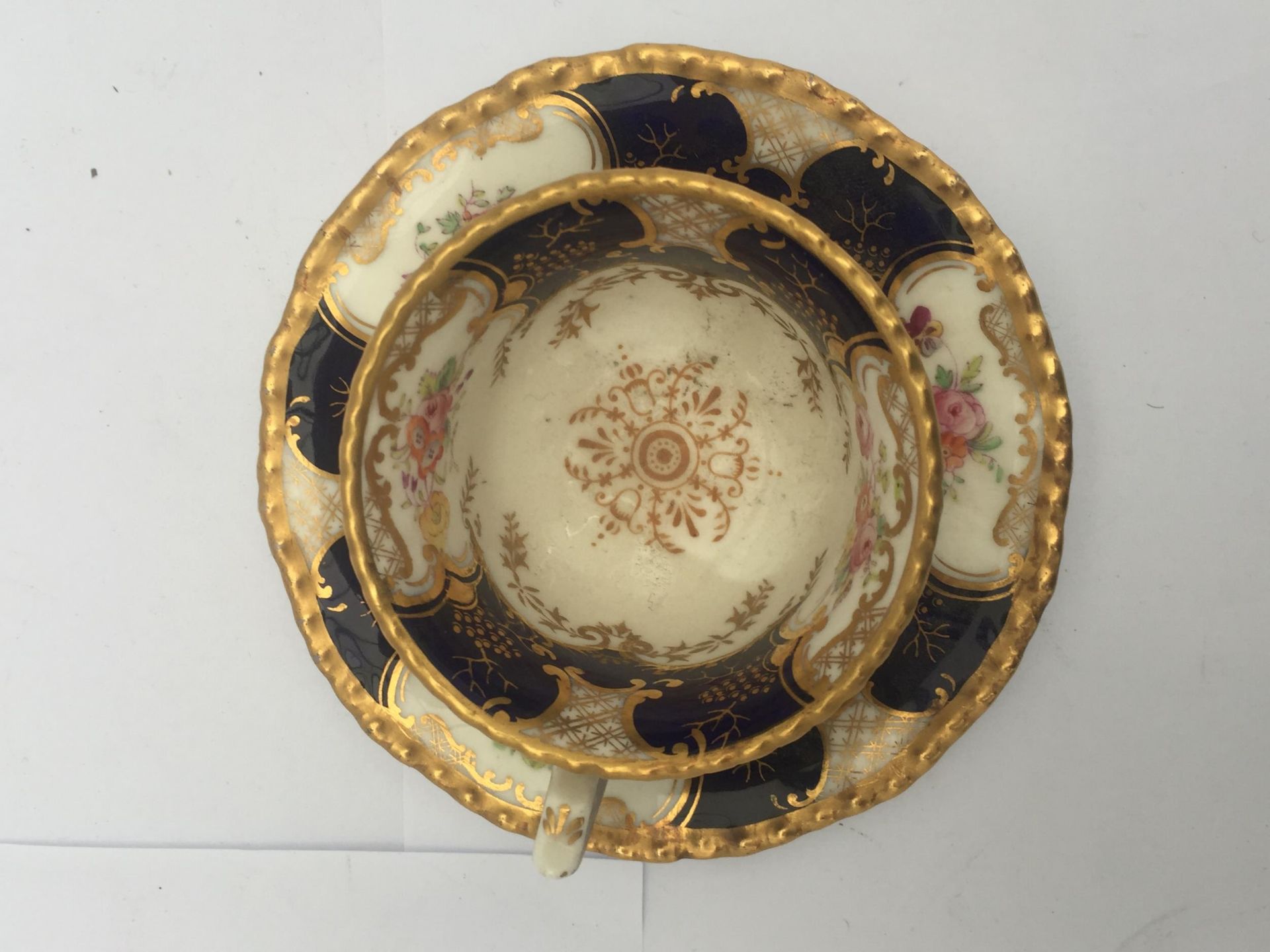 AN ANTIQUE COALPORT BLUE AND GILT Y3517 CUP AND SAUCER - Image 2 of 4