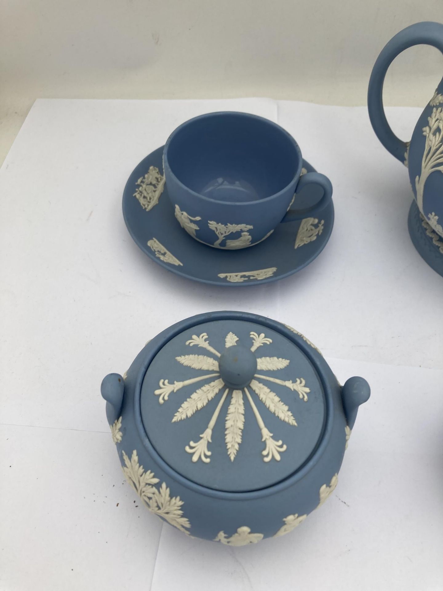 A WEDGWOOD PALE BLUE JASPERWARE TEA FOR ONE BACHELOR SET COMPRISING TEAPOT, SUGAR BOWL, CREAM JUG - Image 2 of 6