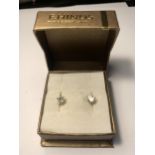 A BOXED PAIR OF 9 CARAT GOLD EARRINGS WITH CLEAR STONES