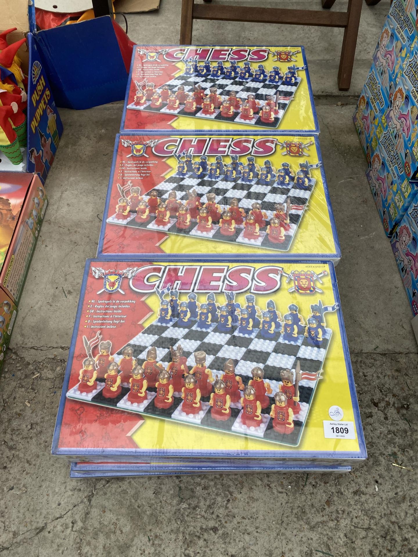 TWELVE NEW AND PACKAGED CHESS SETS