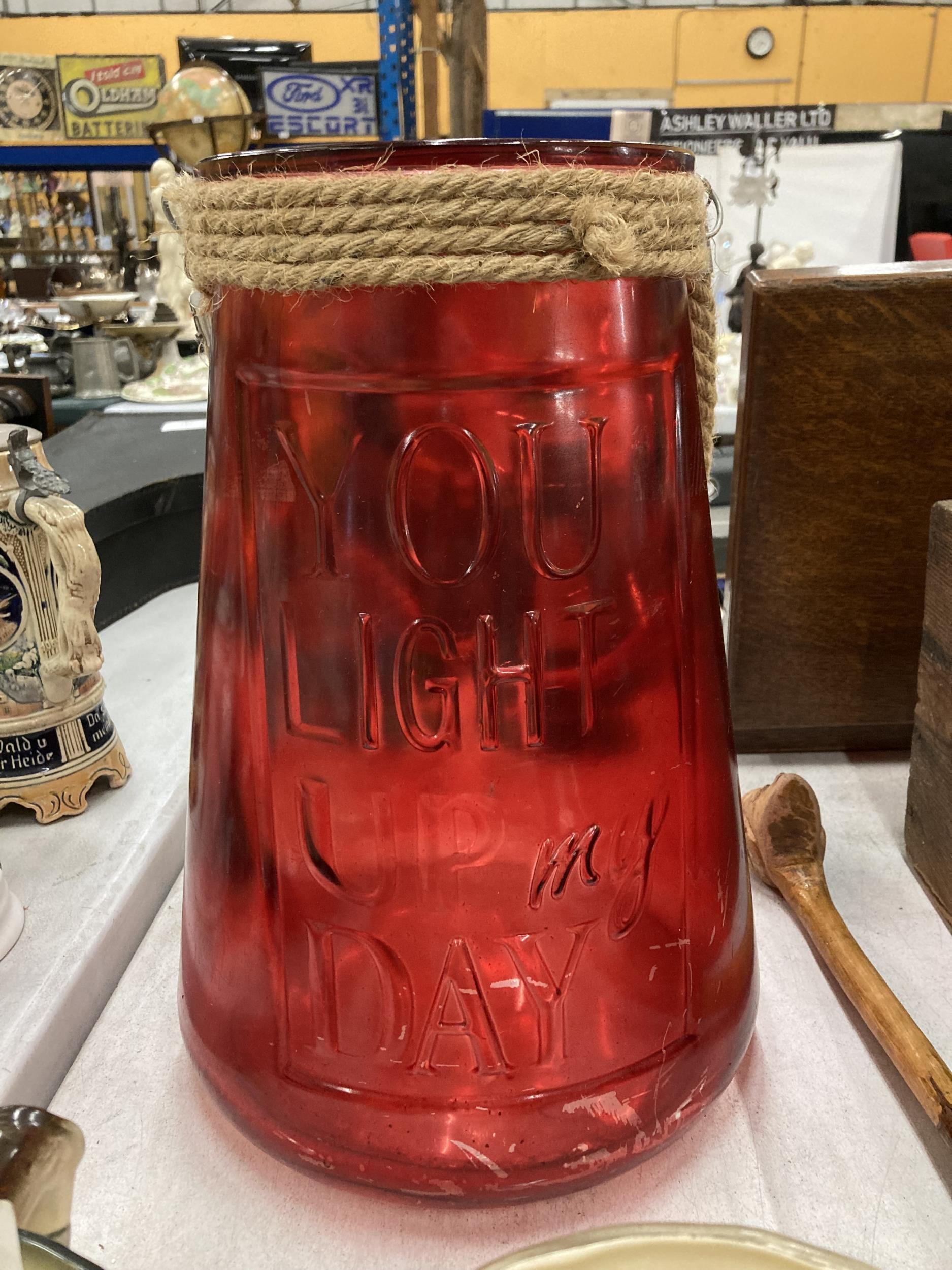 A LARGE RED GLASS YOU LIGHT UP MY DAY URN