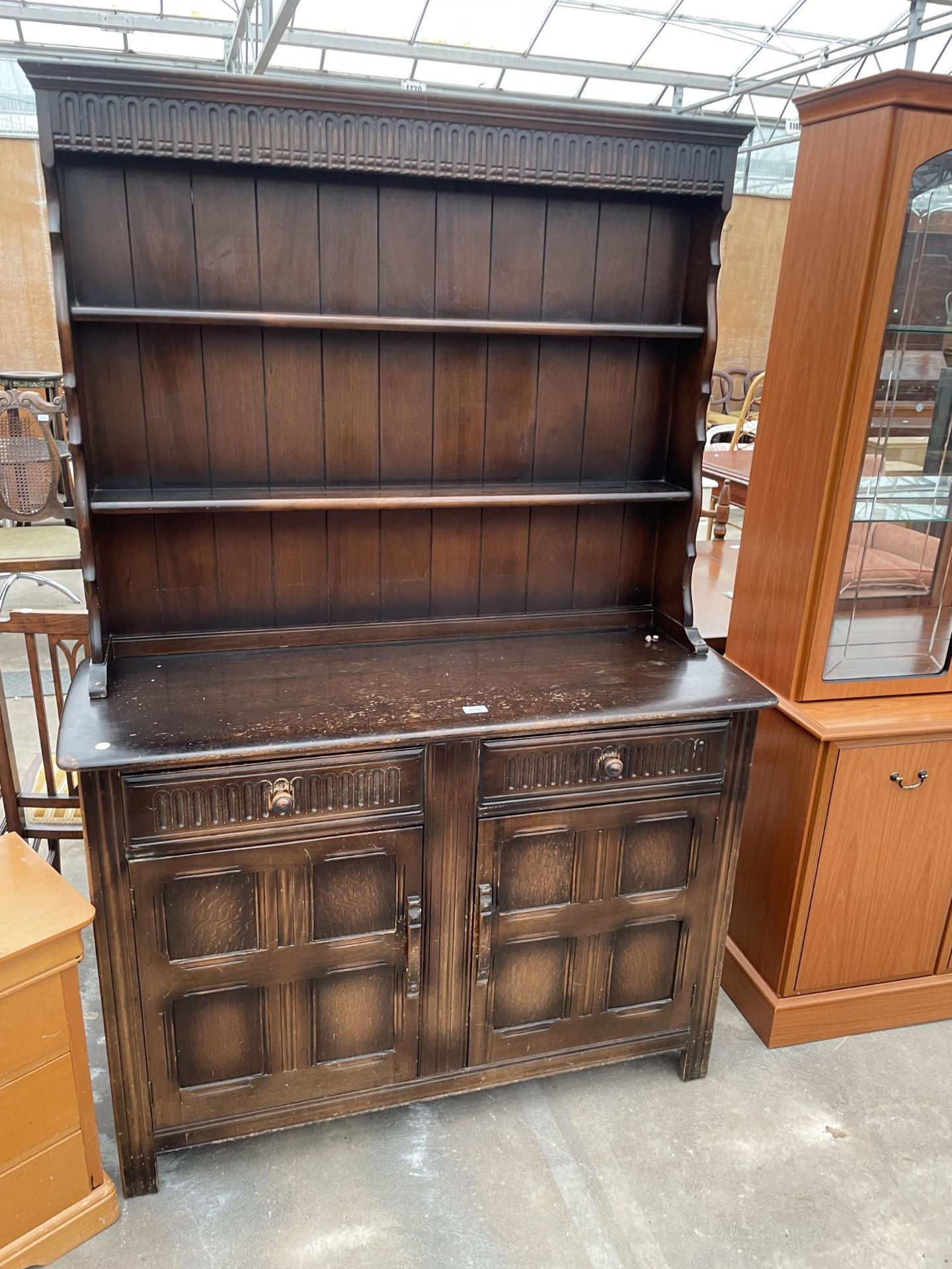 A REPRODUCTION OAK DRESSER COMPLETE WITH PLATE RACK, 48" WIDE