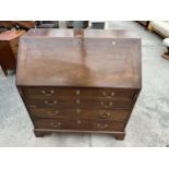 A GEORGE III MAHOGANY BUREAU WITH FITTED INTERIOR OVER FOUR GRADUATED DRAWERS, 39" WIDE