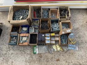 A LARGE ASSORTMENT OF HARDWARE TO INCLUDE BOLTS, SCREWS AND HINGES ETC