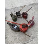 AN ASSORTMENT OF VINTAGE PUMP ACTION OIL CANS TO INCLUDE A WESCO EXAMPLE