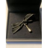 A LINKS OF LONDON CHAMPAGNE BOTTLE CHARM IN A PRESENTATION BOX