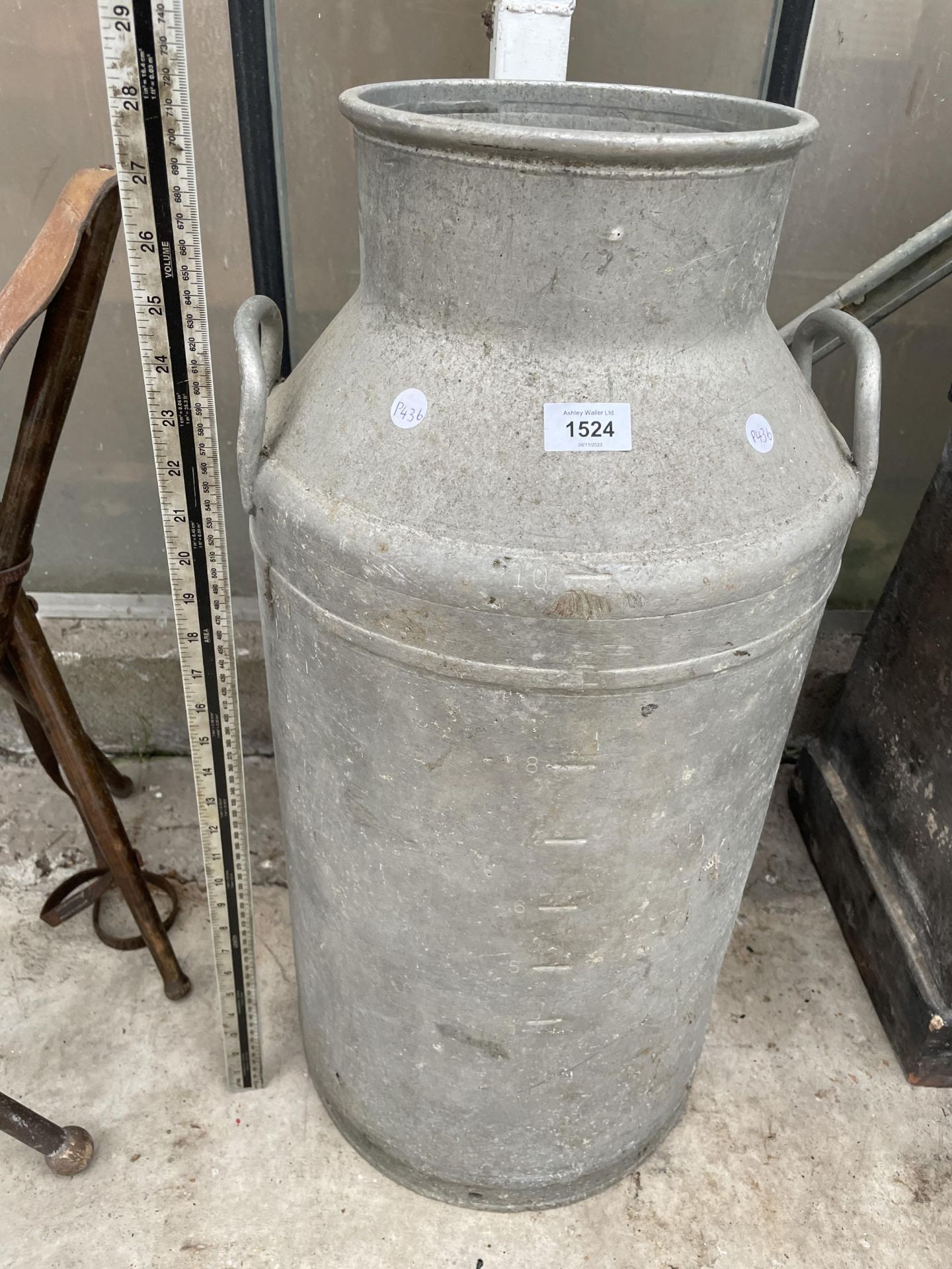 A VINTAGE CAST ALLOY MILK CHURN