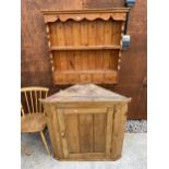 A PINE CORNER CUPBOARD AND PINE WALL SHELVES ENCLOSING FIVE DRAWERS, 33" WIDE