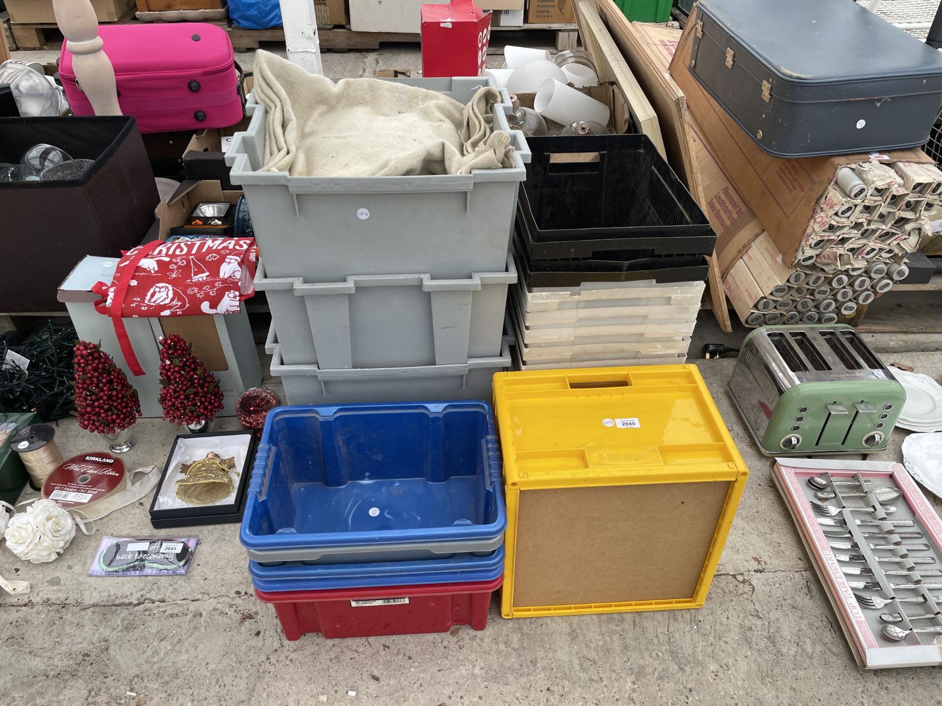 AN ASSORTMENT OF PLASTIC STORAGE BOXES