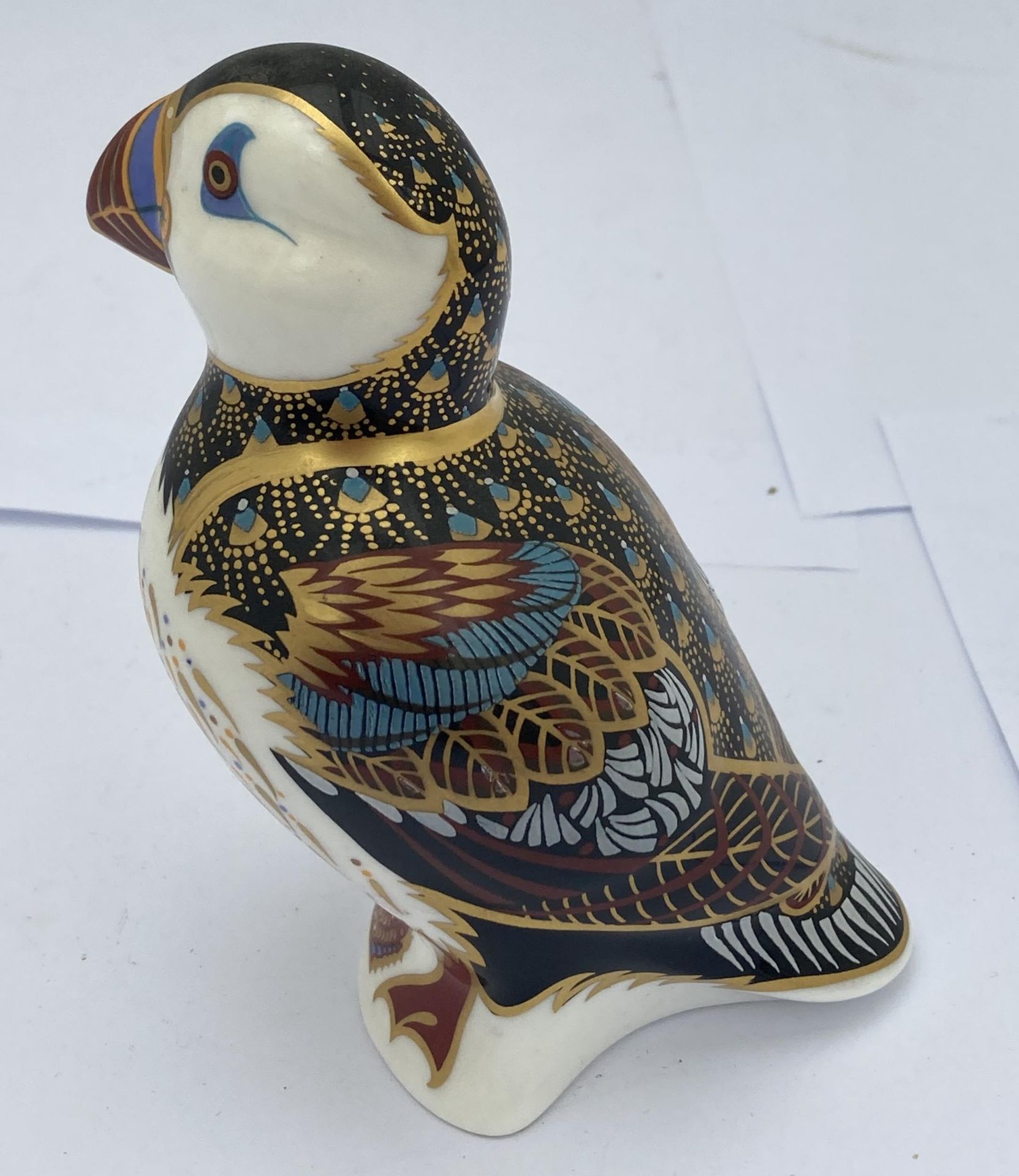 A ROYAL CROWN DERBY PUFFIN PAPERWEIGHT WITH GOLD STOPPER