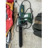 AN ELECTRIC CHAINSAW - NEEDS CHAIN