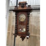 A VINTAGE MAHOGANY CHIMING WALL CLOCK