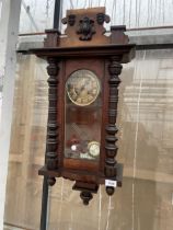 A VINTAGE MAHOGANY CHIMING WALL CLOCK