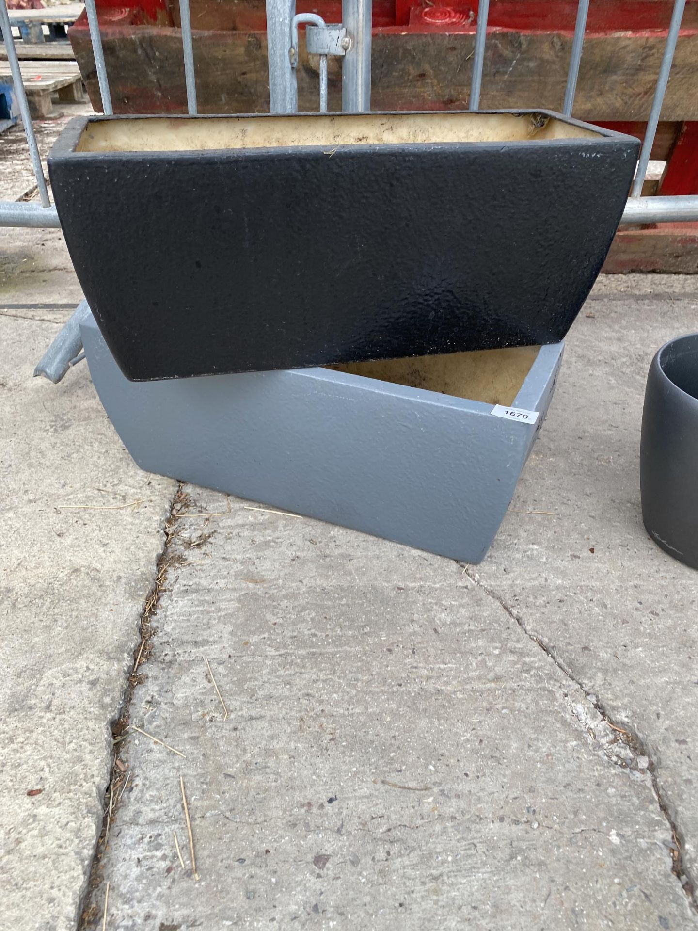 A PAIR OF LOW FIBRE GLASS TROUGH PLANTERS (L:50CM)