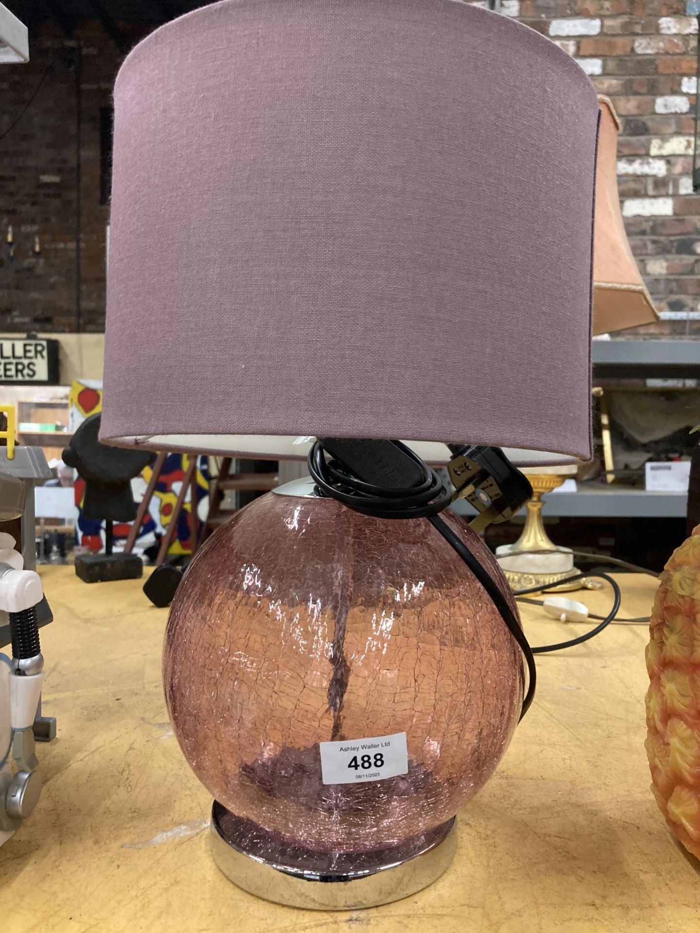 A CRACKLE GLASS LAMP IN PURPLE WITH SHADE