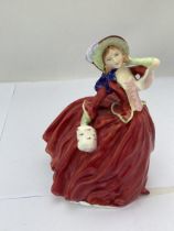 A ROYAL DOULTON 'AUTUMN BREEZES' HN1934 LADY FIGURE