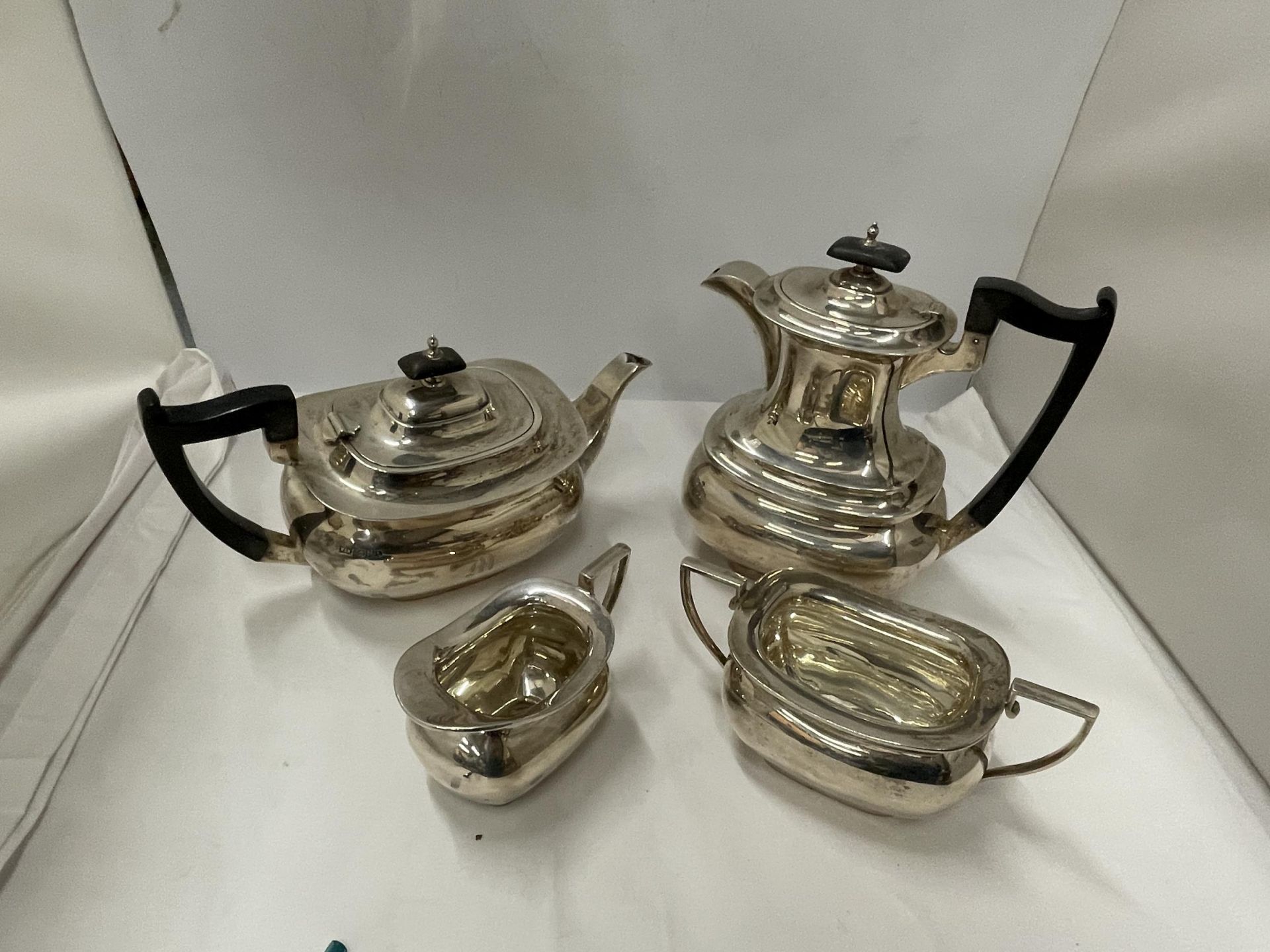 AN HALLMARKED SHEFFIELD WALKER AND HALL SILVER FOUR PIECE TEA SET WEIGHT 1864g