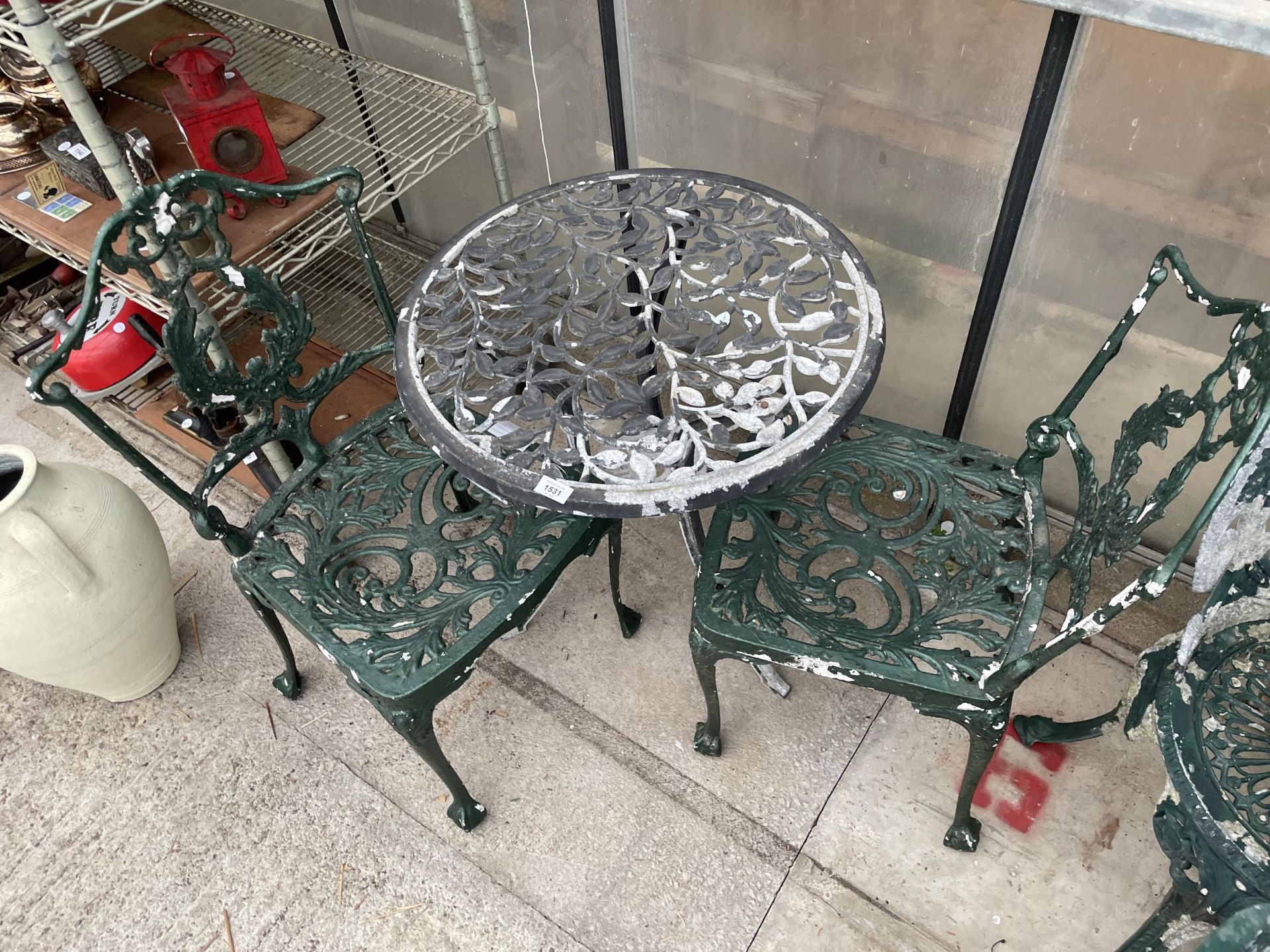 A CAST ALLOY BISTRO TABLE AND TWO CAST ALLOY CHAIRS - Image 2 of 2