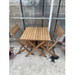 A WOODEN FOLDING BISTRO TABLE AND TWO CHAIRS