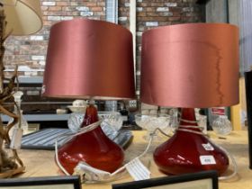 A PAIR OF MODERN RED TABLE LAMPS WITH SHADES
