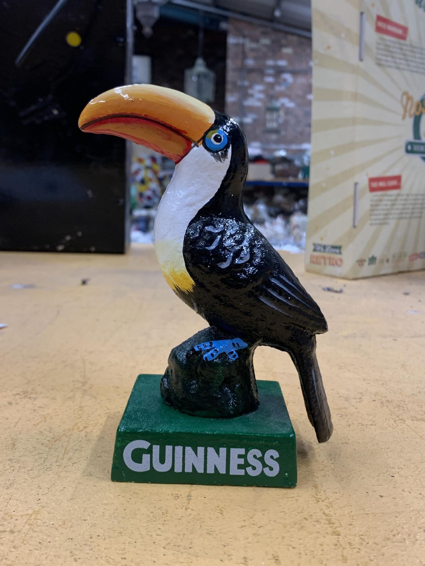 A CAST PAINTED GUINNESS TOUCAN MODEL