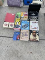 A SILVER-REED TYPEWRITER AND AN ASSORTMENT OF BOOKS