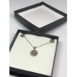 A BOXED SILVER NECKLACE AND EARRINGS SET