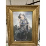 A LARGE PRINT OF A LADY ON A BICYCLE IN AN ORNATE GILT FRAME, 76CM X 103CM