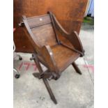 A VINTAGE OAK GLASTONBURY CHAIR