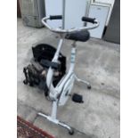 TWO ITEMS TO INCLUDE AN ELECTRIC FIRE AND AN EXERCISE BIKE